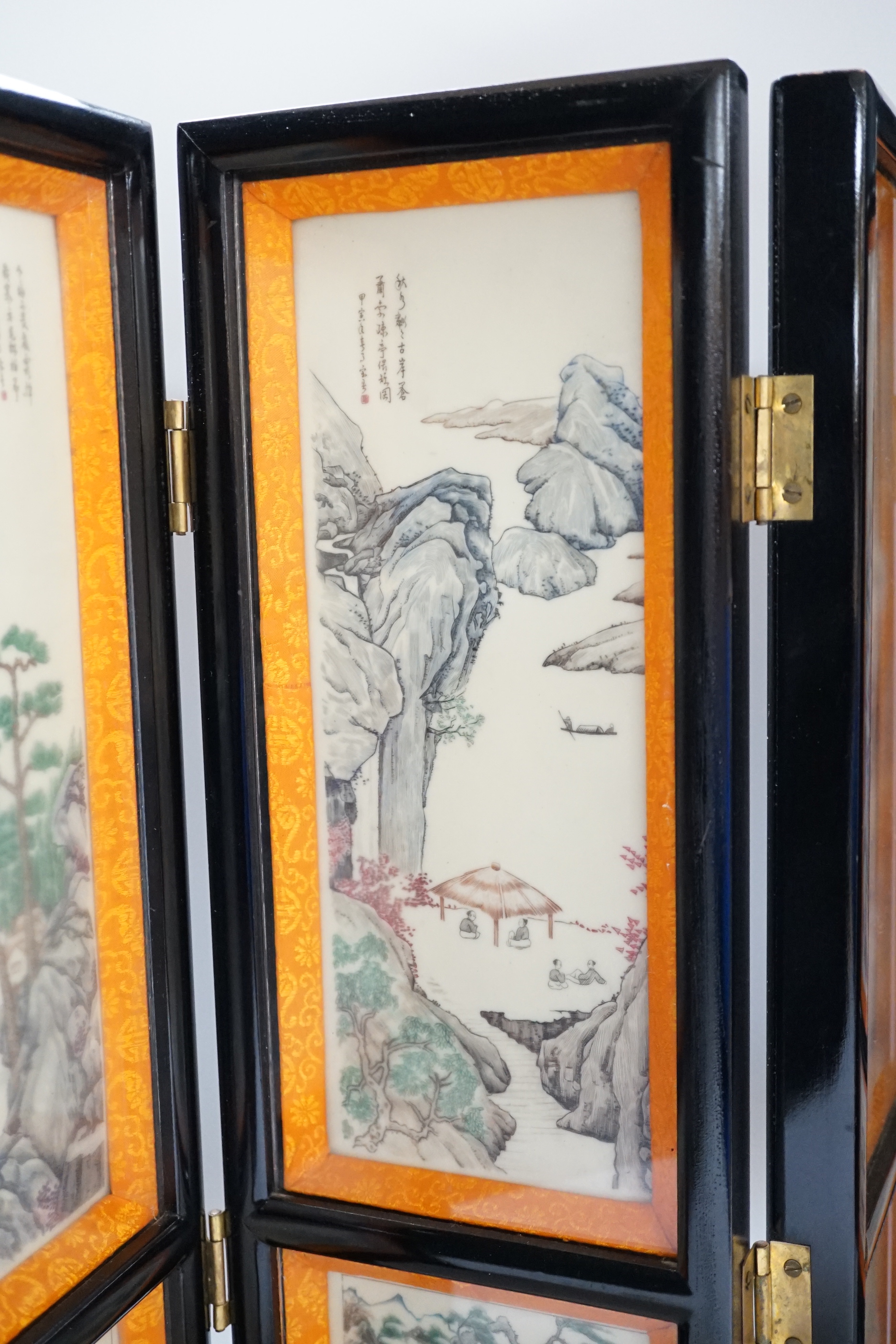 A 20th century Chinese resin three fold screen, 46cm tall